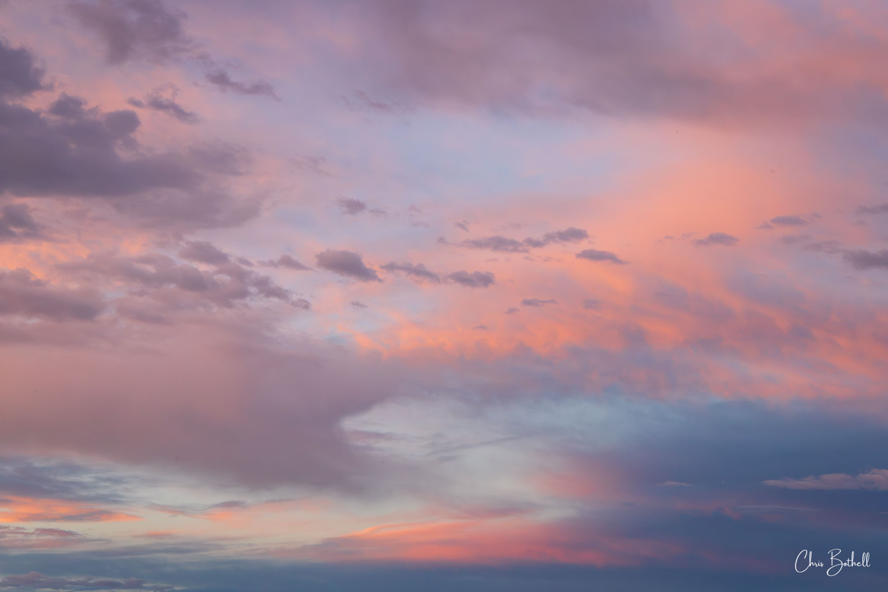 Cotton Canday Clouds 2 The pink and blue colors of the clouds at sunset resemble cotton candy as they paint a beautiful scene in the darkening sky.