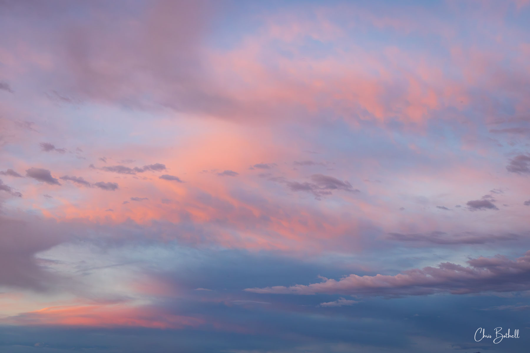 Cotton Candy Clouds The pink and blue colors of the clouds at sunset resemble cotton candy as they paint a beautiful scene in the darkening sky.